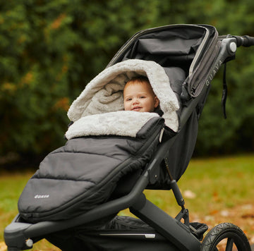 cozy baby in the Roam Performance Footmuff